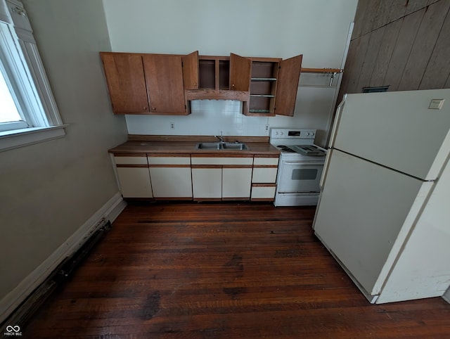 kitchen featuring white appliances, backsplash, dark wood-type flooring, white cabinets, and sink