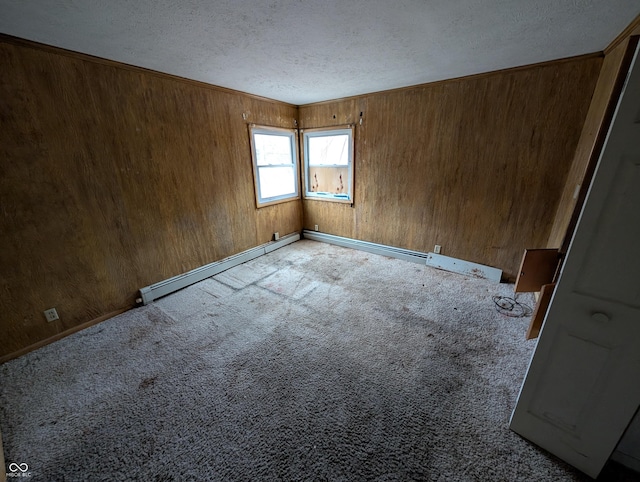 empty room with baseboard heating, light carpet, and a textured ceiling