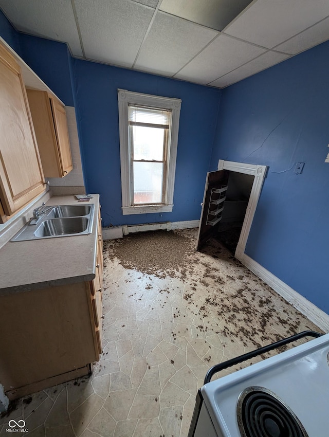 kitchen with light brown cabinetry, electric range, a drop ceiling, and sink