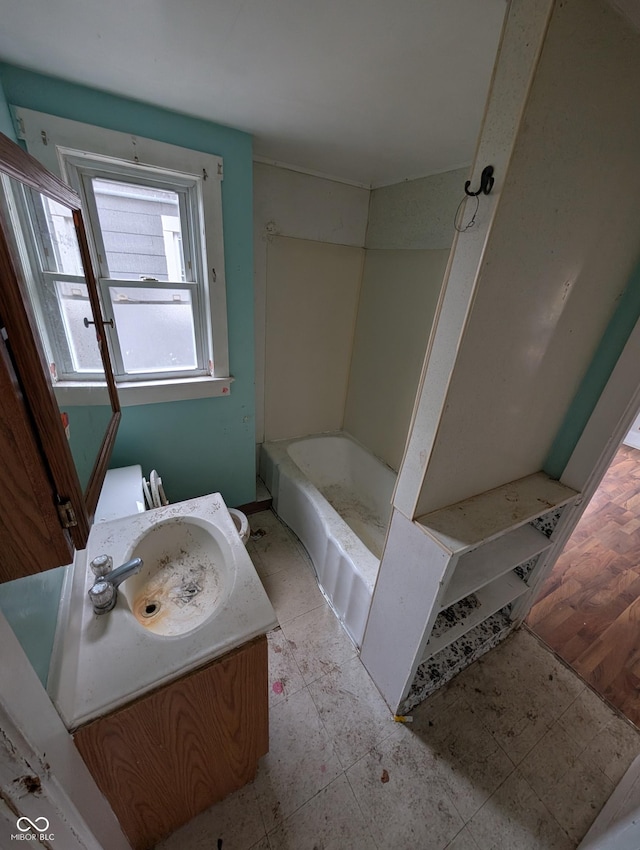 bathroom with vanity and shower with separate bathtub