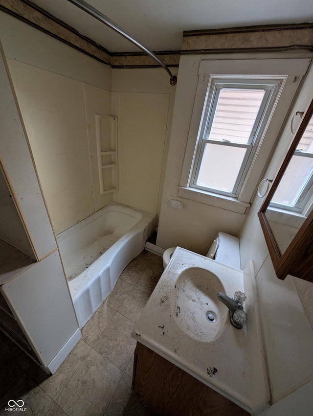 bathroom with tub / shower combination and sink