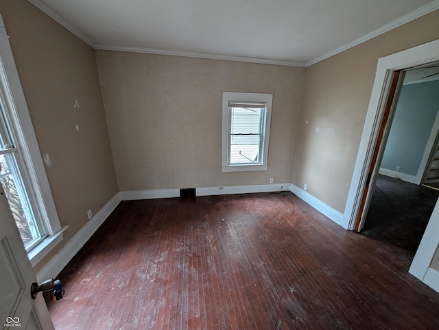 spare room with dark hardwood / wood-style flooring and ornamental molding