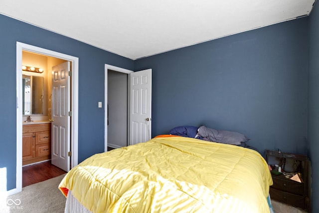 bedroom with carpet and ensuite bath