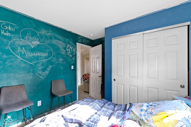 carpeted bedroom with a closet