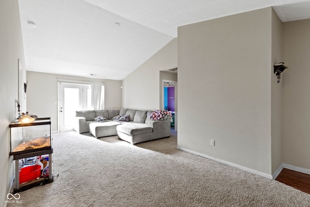 living room with carpet flooring and lofted ceiling