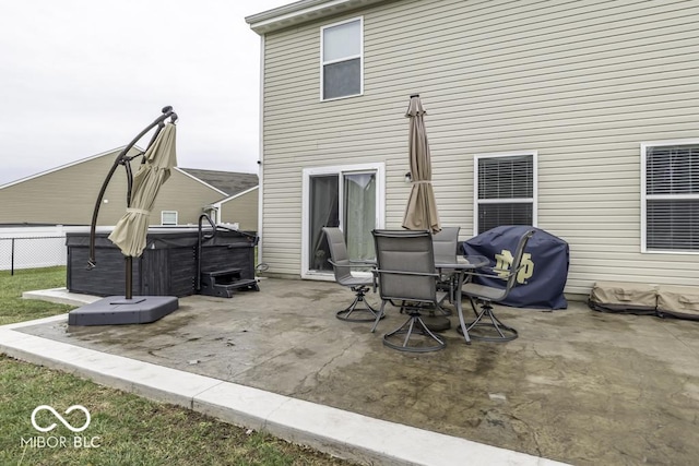 view of patio featuring a grill and a hot tub