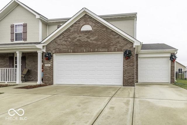 front of property with a porch and a garage