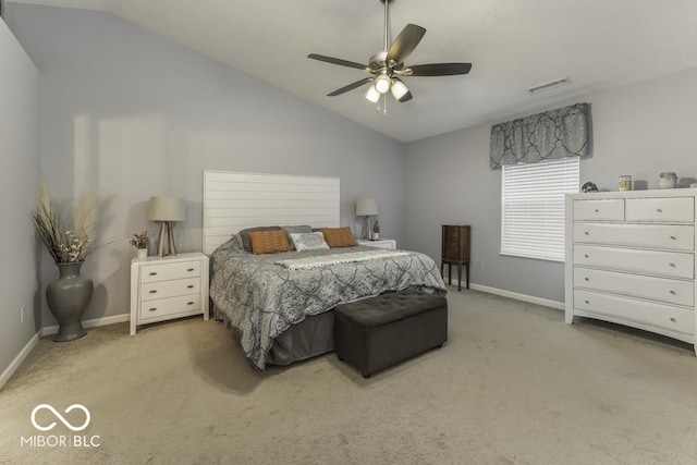 carpeted bedroom with ceiling fan and vaulted ceiling