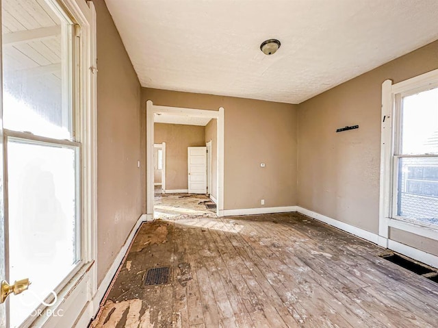 spare room featuring hardwood / wood-style flooring