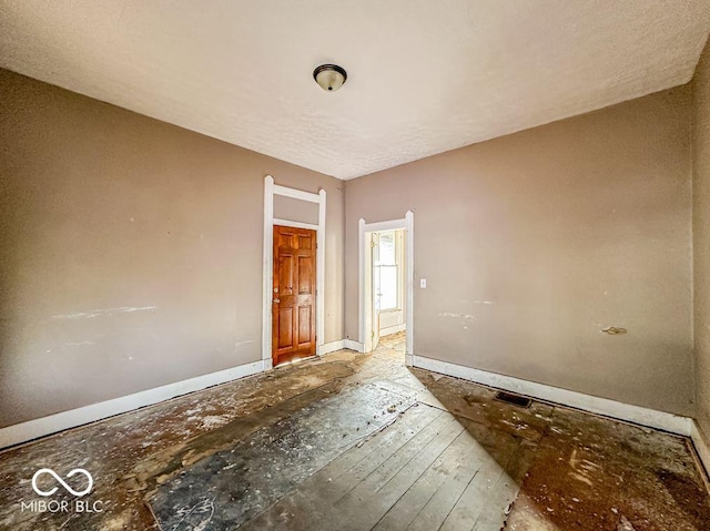 unfurnished room featuring hardwood / wood-style floors