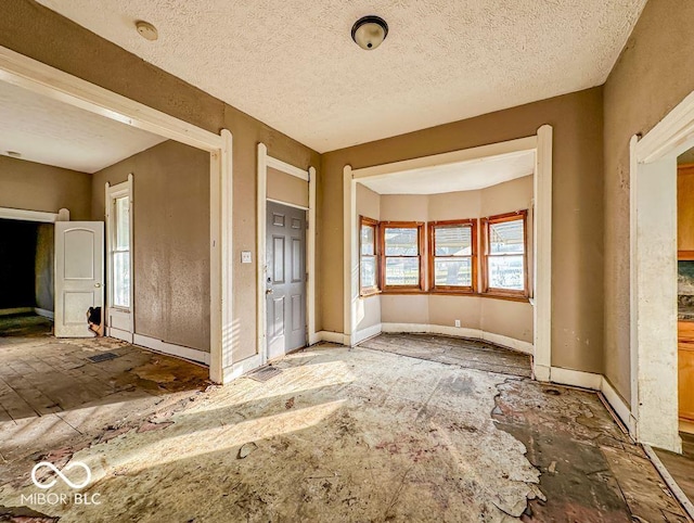 unfurnished bedroom featuring a textured ceiling