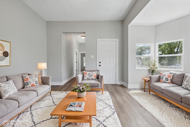 2218 N Arsenal Ave, Indianapolis, IN 46218 - living room featuring light wood-type flooring and baseboards