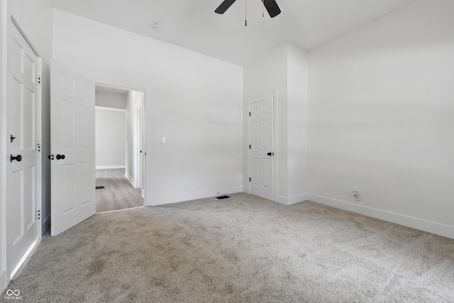 2218 N Arsenal Ave, Indianapolis, IN 46218 - unfurnished bedroom featuring carpet and ceiling fan