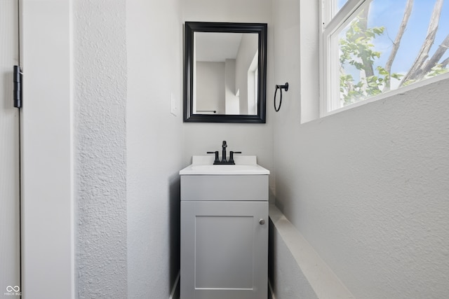 2218 N Arsenal Ave, Indianapolis, IN 46218 - bathroom featuring vanity and a textured wall