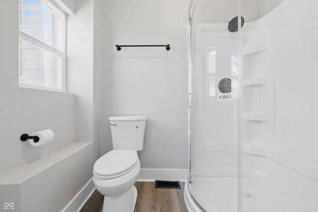 2218 N Arsenal Ave, Indianapolis, IN 46218 - bathroom with wood finished floors and a shower stall