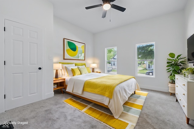 2218 N Arsenal Ave, Indianapolis, IN 46218 - carpeted bedroom with a ceiling fan and baseboards