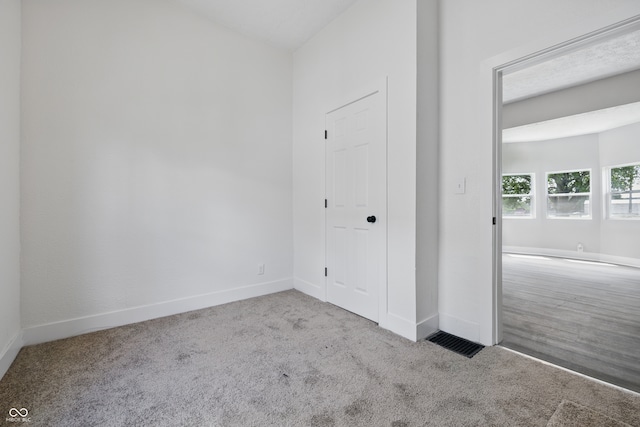 2218 N Arsenal Ave, Indianapolis, IN 46218 - carpeted empty room with baseboards