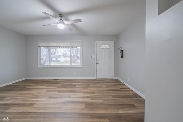 entrance foyer with ceiling fan and light hardwood / wood-style flooring