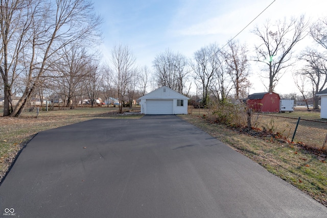 exterior space featuring an outbuilding and a garage