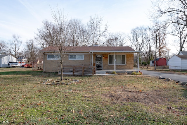 view of front of property featuring covered porch and a front lawn