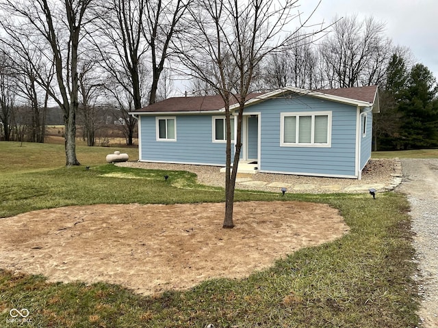 rear view of house with a lawn