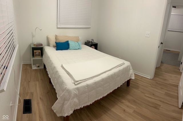 bedroom featuring light hardwood / wood-style flooring