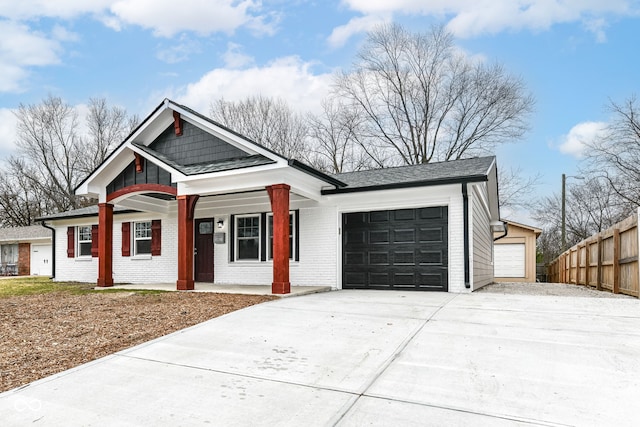 view of front of property with a porch and a garage