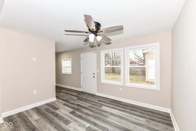 unfurnished room featuring dark hardwood / wood-style flooring and ceiling fan