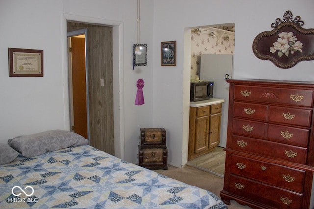 bedroom featuring light carpet