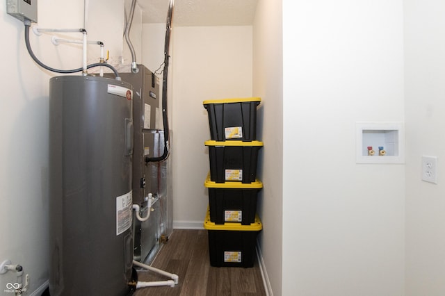 utility room featuring water heater