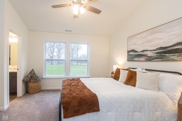 bedroom featuring carpet flooring, connected bathroom, and ceiling fan