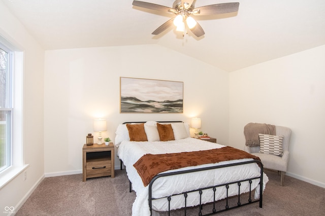 bedroom featuring light carpet, vaulted ceiling, and ceiling fan