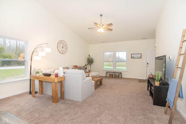 carpeted living room featuring ceiling fan and high vaulted ceiling