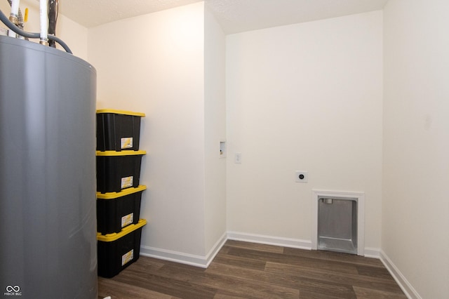 laundry room with hookup for an electric dryer, dark wood-type flooring, and water heater