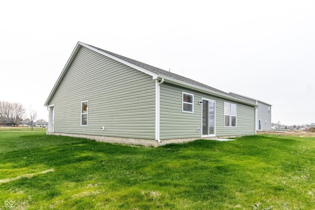 view of home's exterior featuring a lawn