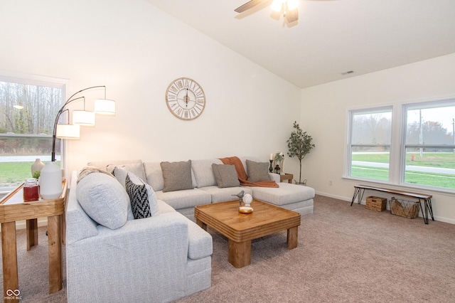 living room with ceiling fan, carpet, and high vaulted ceiling