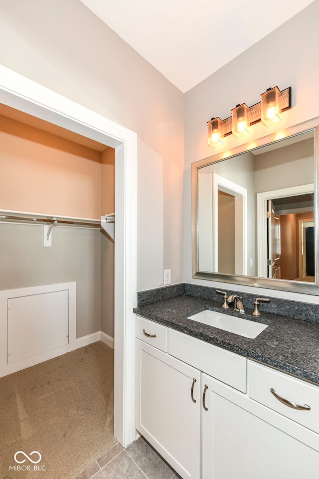 bathroom with tile patterned floors and vanity