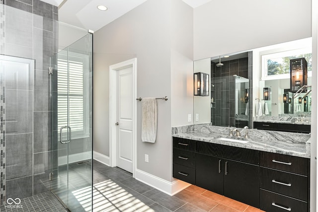 bathroom featuring recessed lighting, baseboards, a shower stall, and vanity