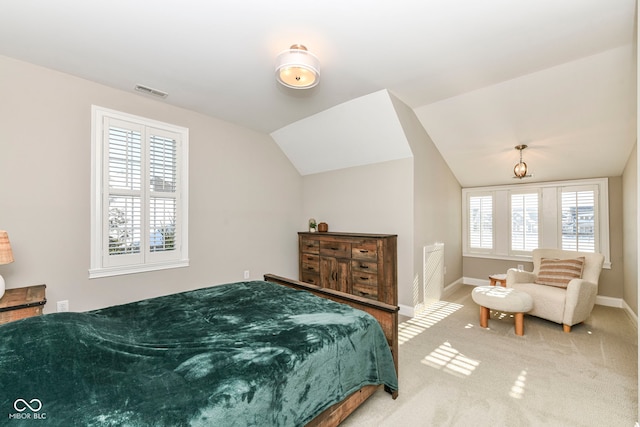 bedroom with carpet flooring, lofted ceiling, and multiple windows