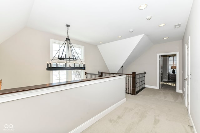 hallway with lofted ceiling, recessed lighting, light colored carpet, an upstairs landing, and baseboards