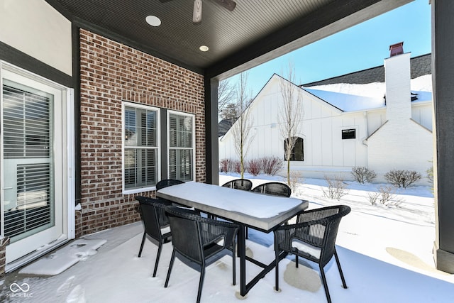 view of snow covered patio