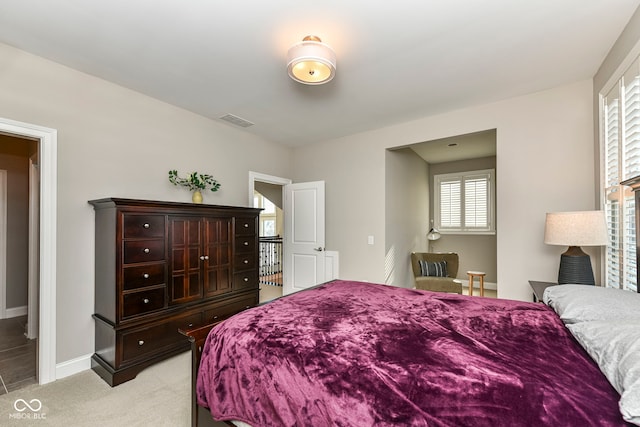 bedroom featuring light colored carpet