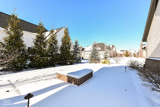 view of yard covered in snow