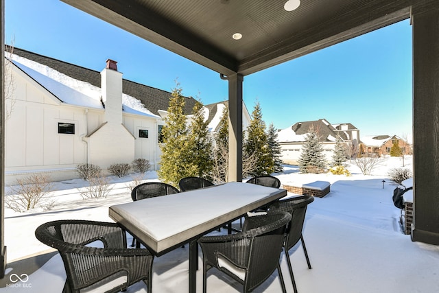 view of snow covered patio