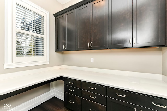 kitchen featuring dark brown cabinetry