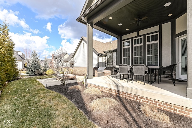 view of patio featuring ceiling fan, outdoor dining space, and area for grilling