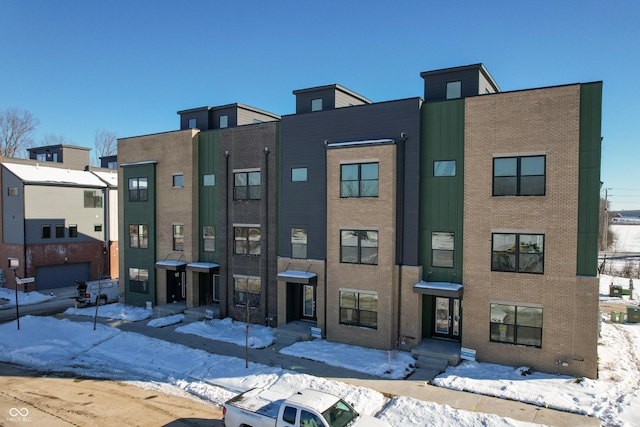 view of snow covered property