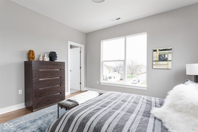 bedroom featuring wood-type flooring