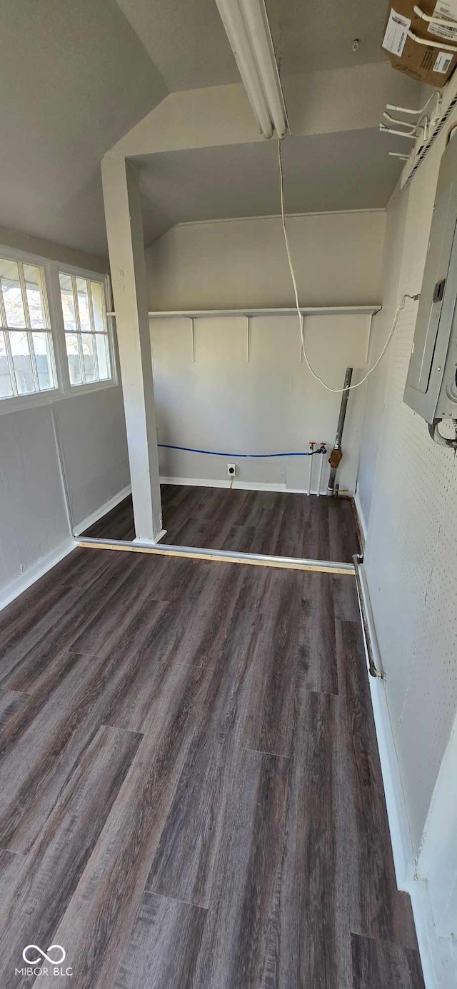 interior space with dark hardwood / wood-style flooring and electric panel