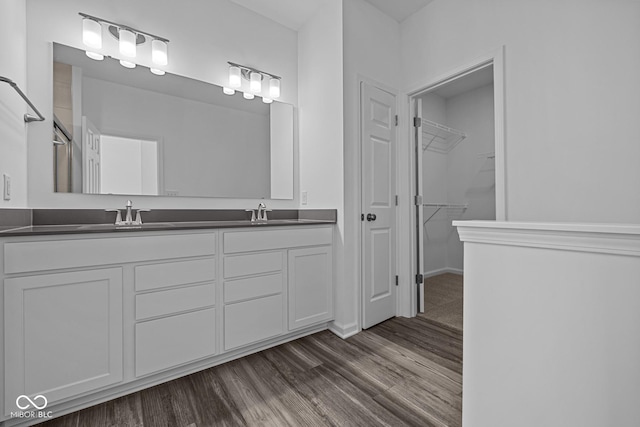 bathroom featuring hardwood / wood-style flooring and vanity